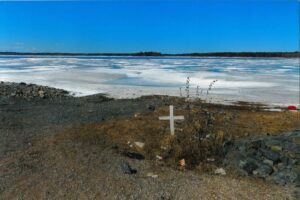 “The cross that you see represents a young person, my nephew, who drowned in the shoreline. The younger generation in Cross Lake do not fully understand that the level of water fluctuates…the water is muddy, green and brown…they had a hard time finding him under the water.”